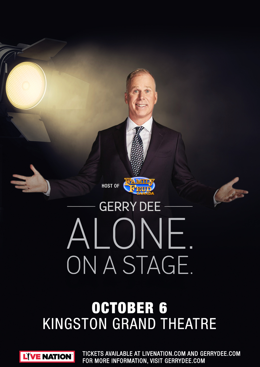 Gerry Dee is being lit by a stage light. He wears a suit. The poster is titled "Host of Family Feud Canada. Gerry Dee. Alone. On A Stage."