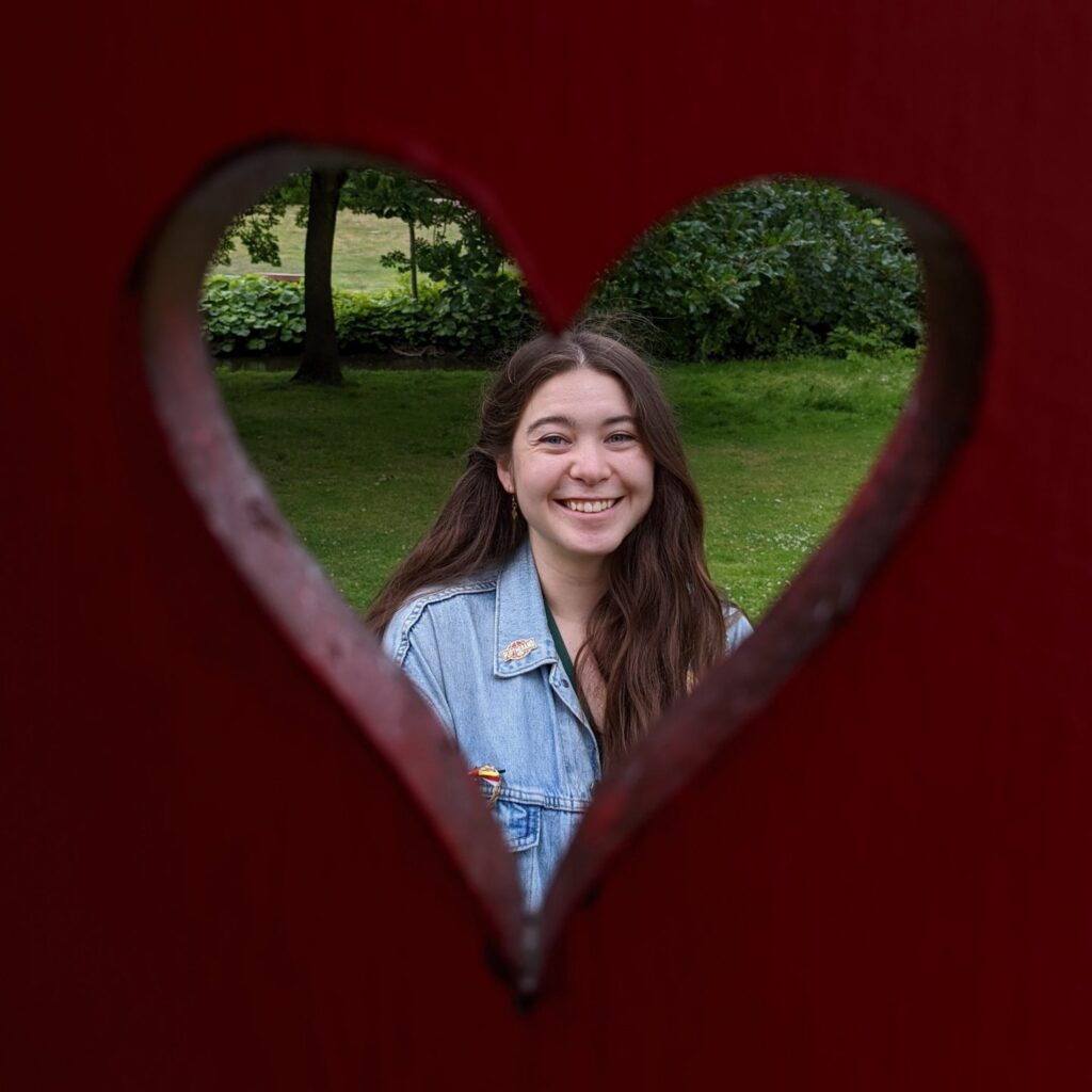 Photo of Billie Kearns. She is smiling and there is a heart around her face. 