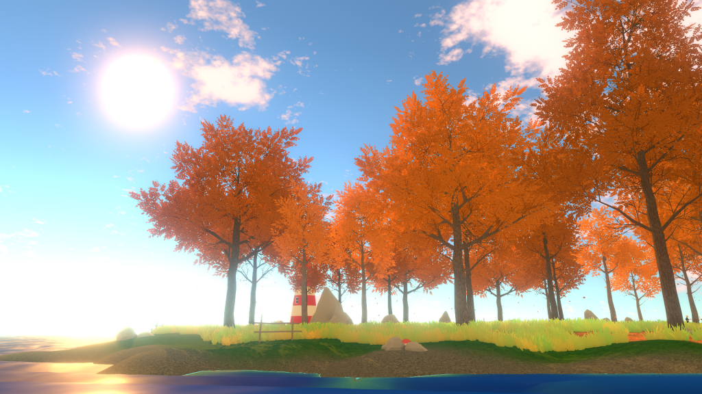 Image of a Virtual Reality world. There is a clear blue sky with very few clouds. Lovely green grass is below the sky with large, full maple trees that have reddish-orange leaves. A bright sun is in the sky. Water approaches the edge of the grass. 