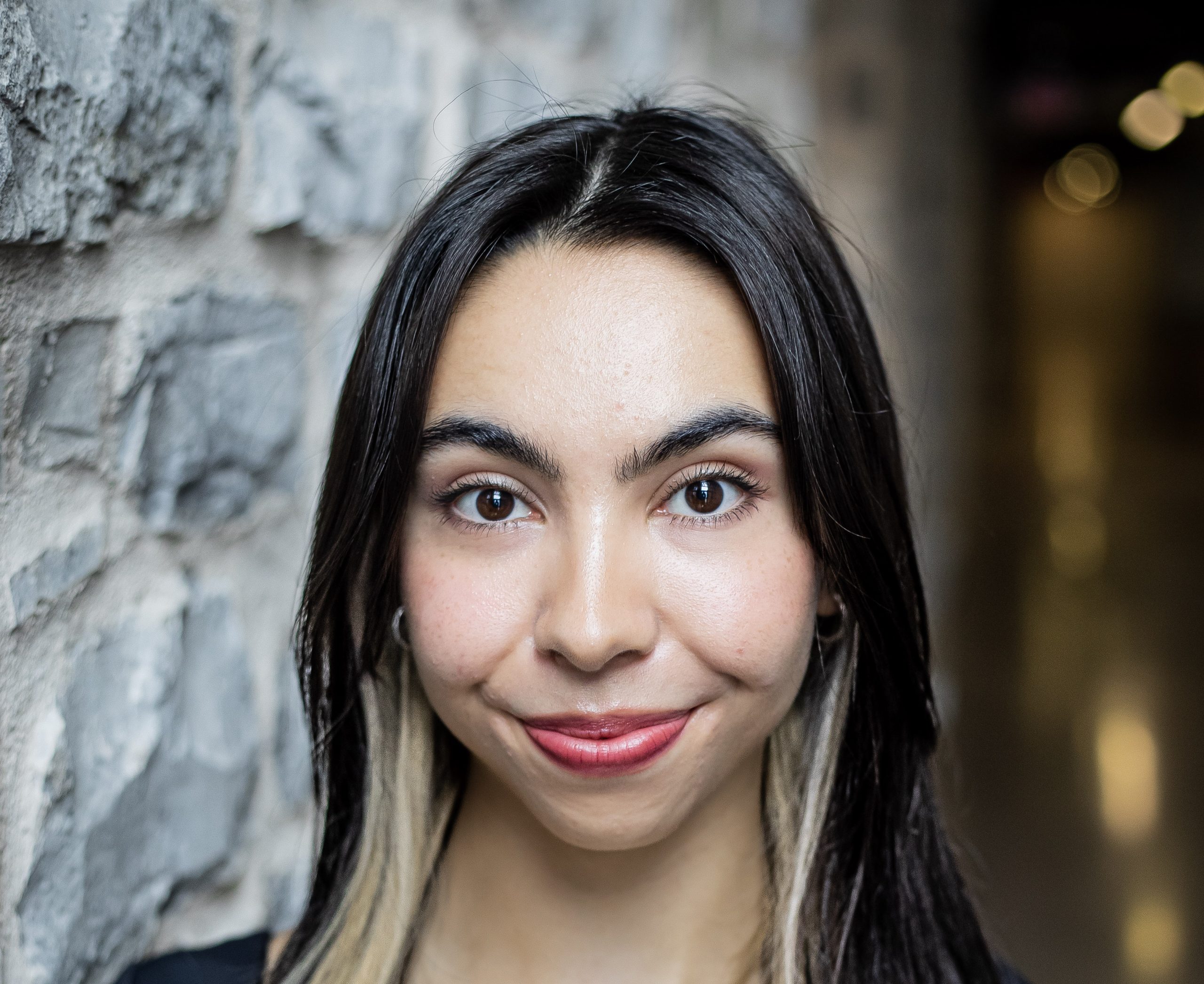 Headshot of Felicia Holmes. She smiles into the camera.