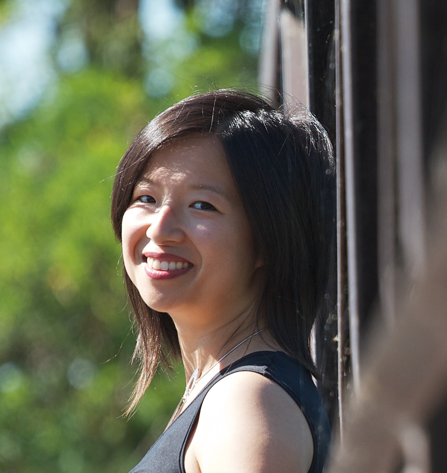 A woman with black hair smiling