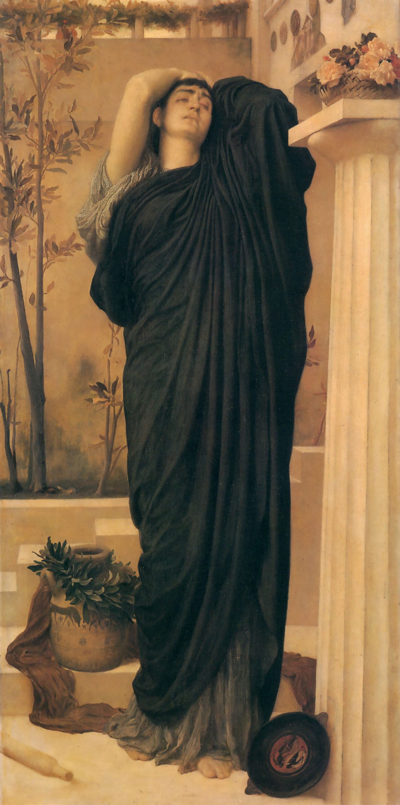 Electra sorrowfully leans against a tomb in a long robe. 