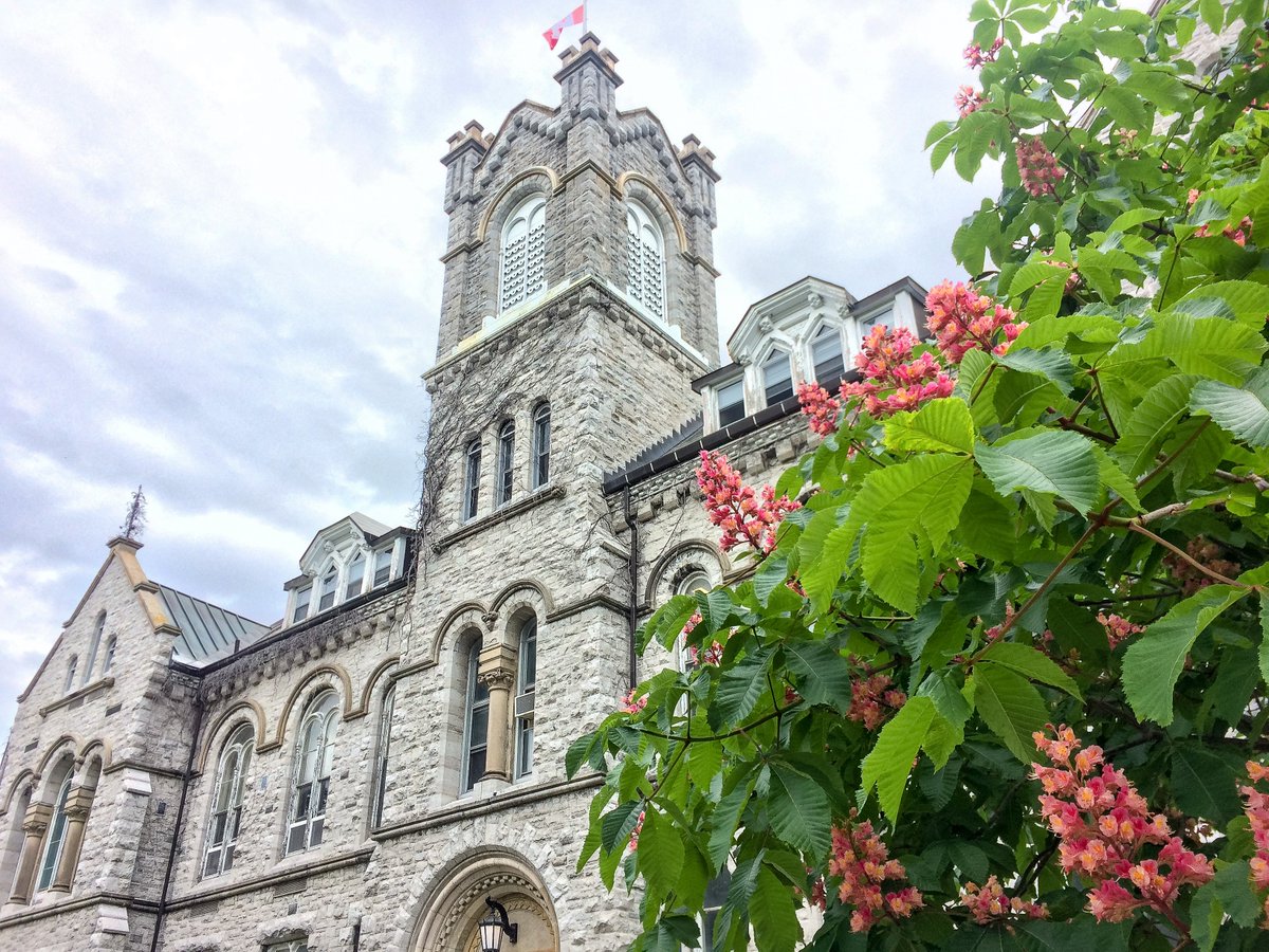Limestone building, tree in foreground.