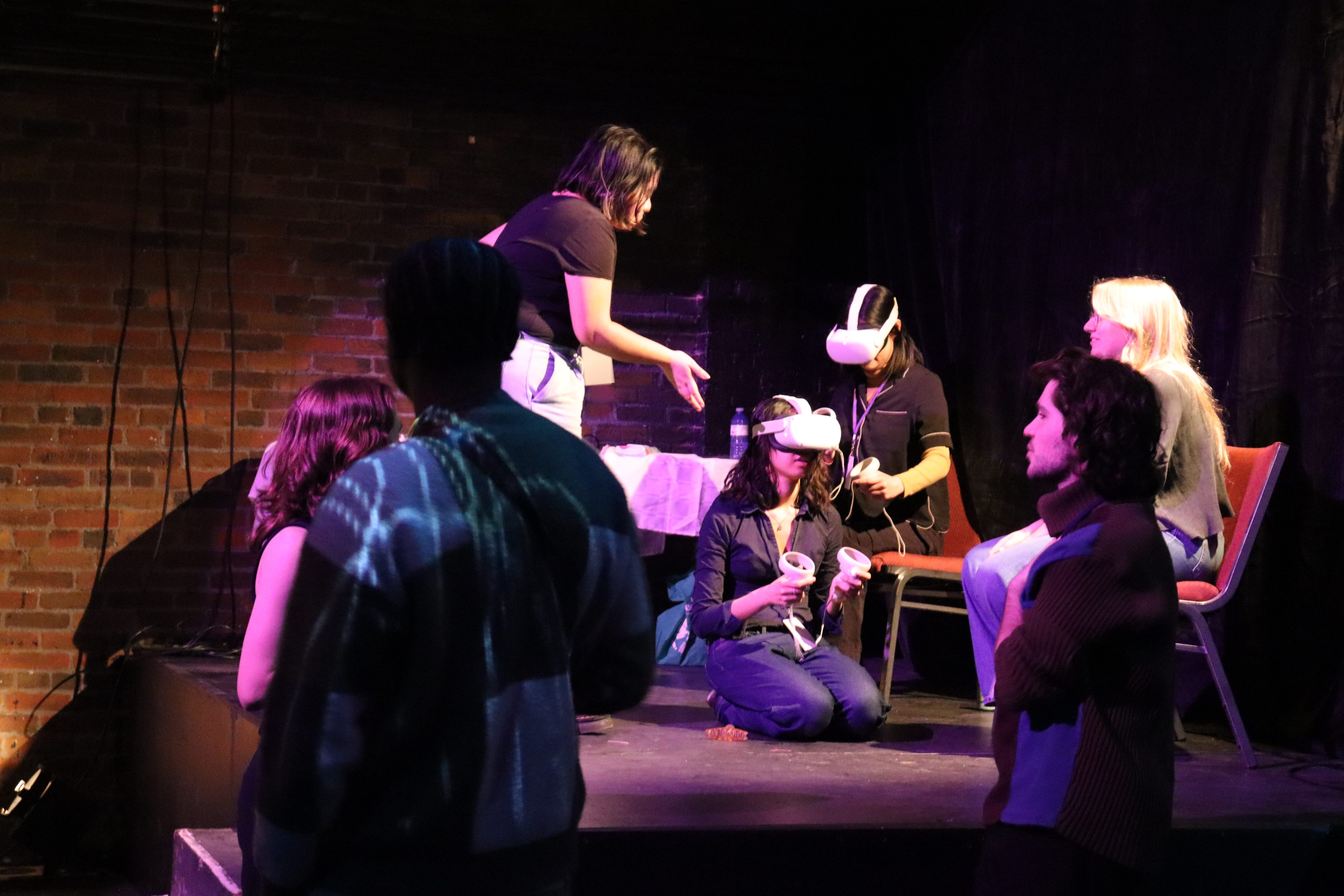 A group of people sitting and wearing VR headsets.